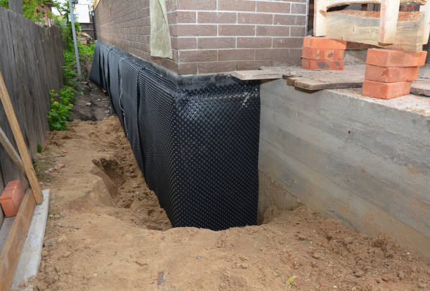Happy homeowners after waterproofing job in East Rockaway